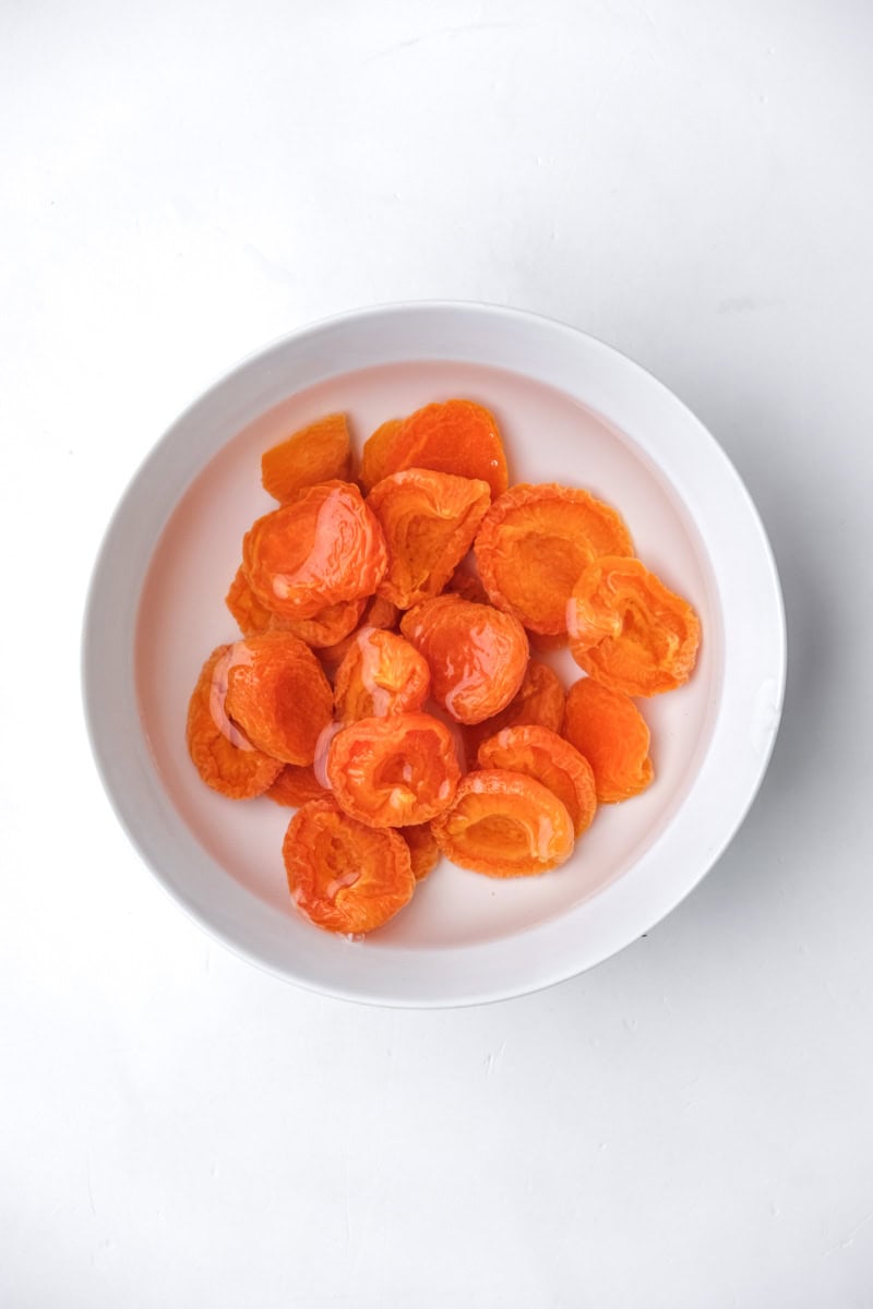 Image shows step 1 of how to make an almond and apricot cake.