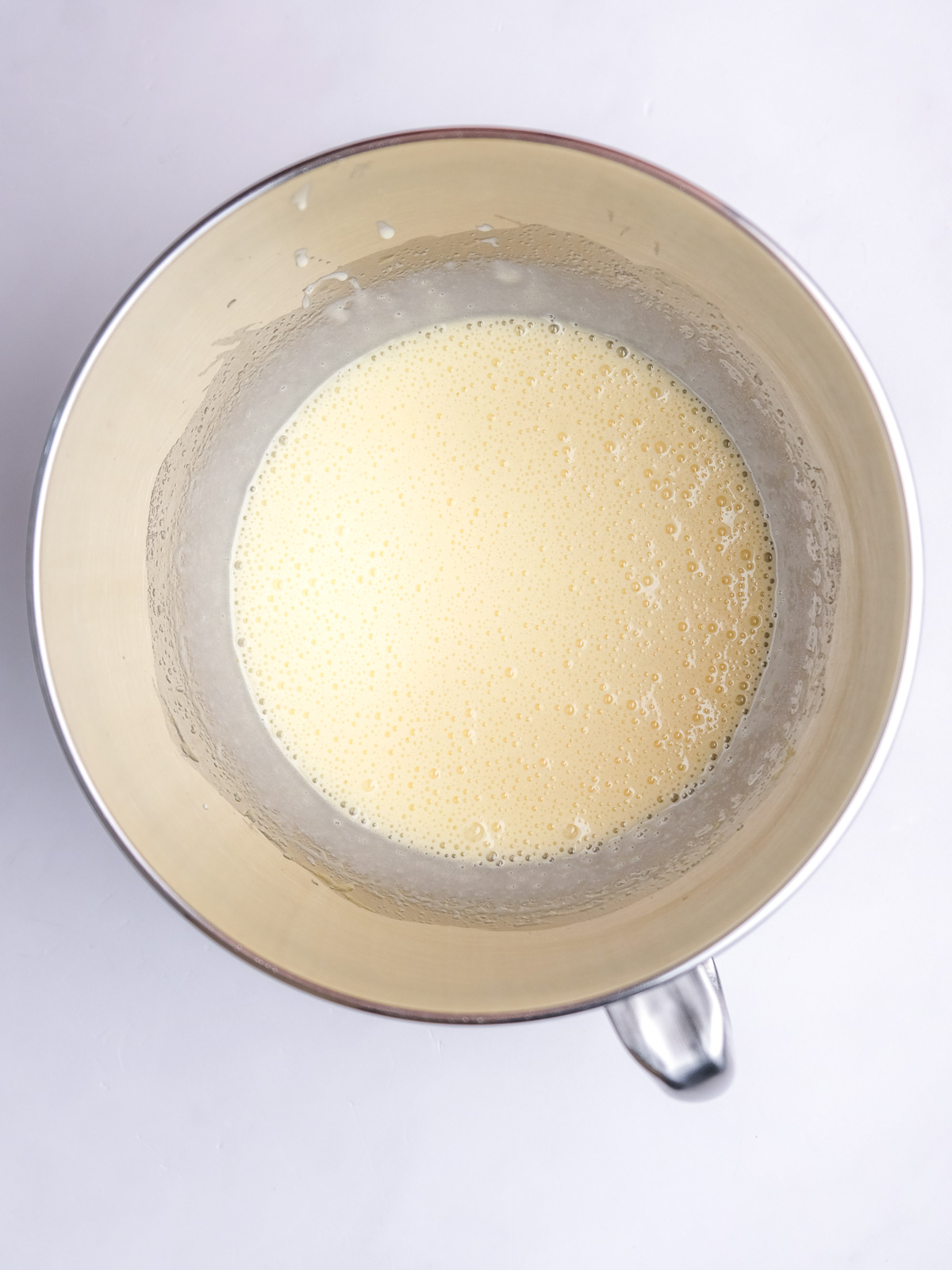 Image shows step 1 of how to make vanilla cupcakes for this peppermint crisp cupcake recipe.