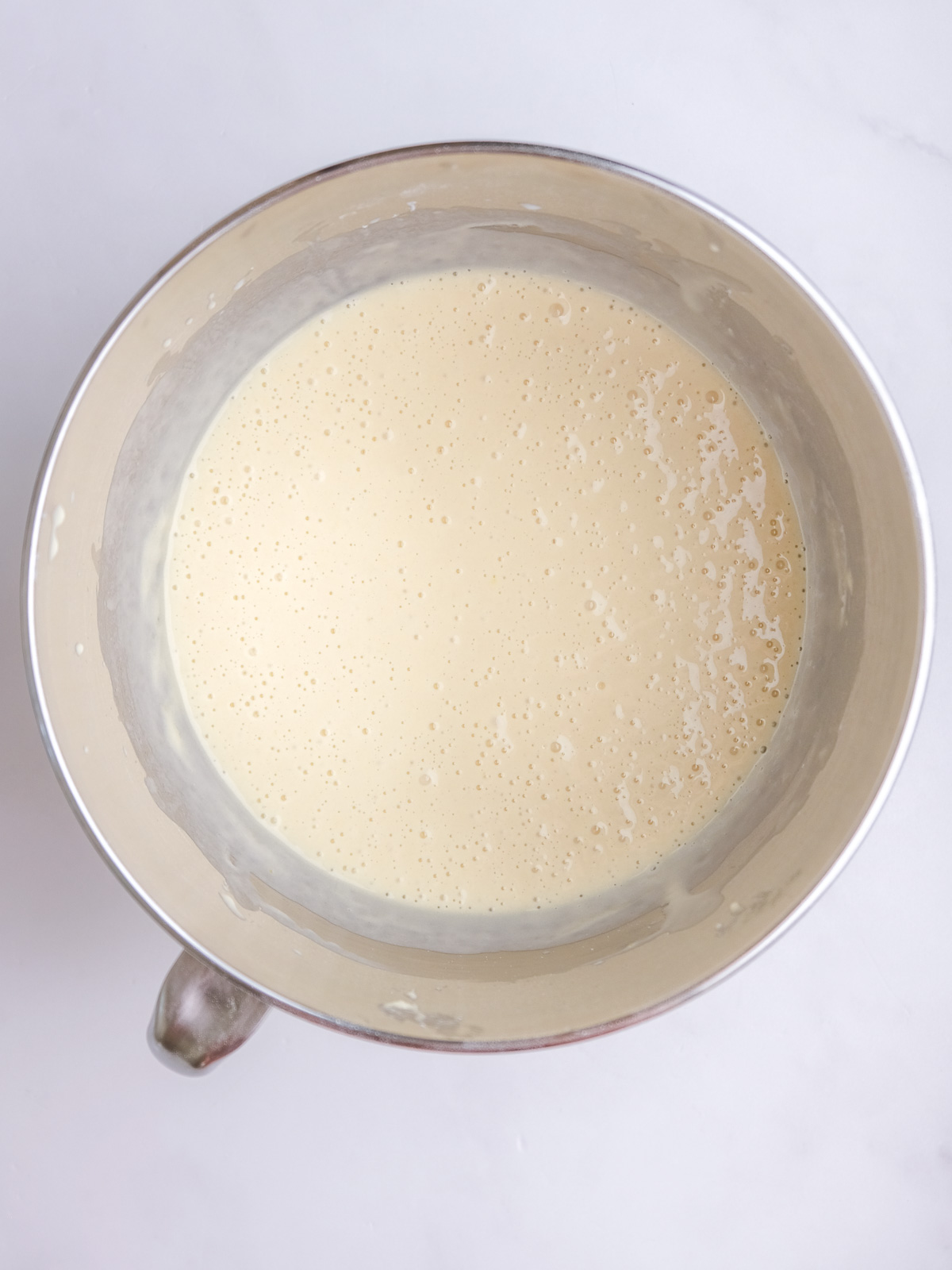 Image shows step 2 of how to make vanilla cupcakes for this peppermint crisp cupcake recipe.
