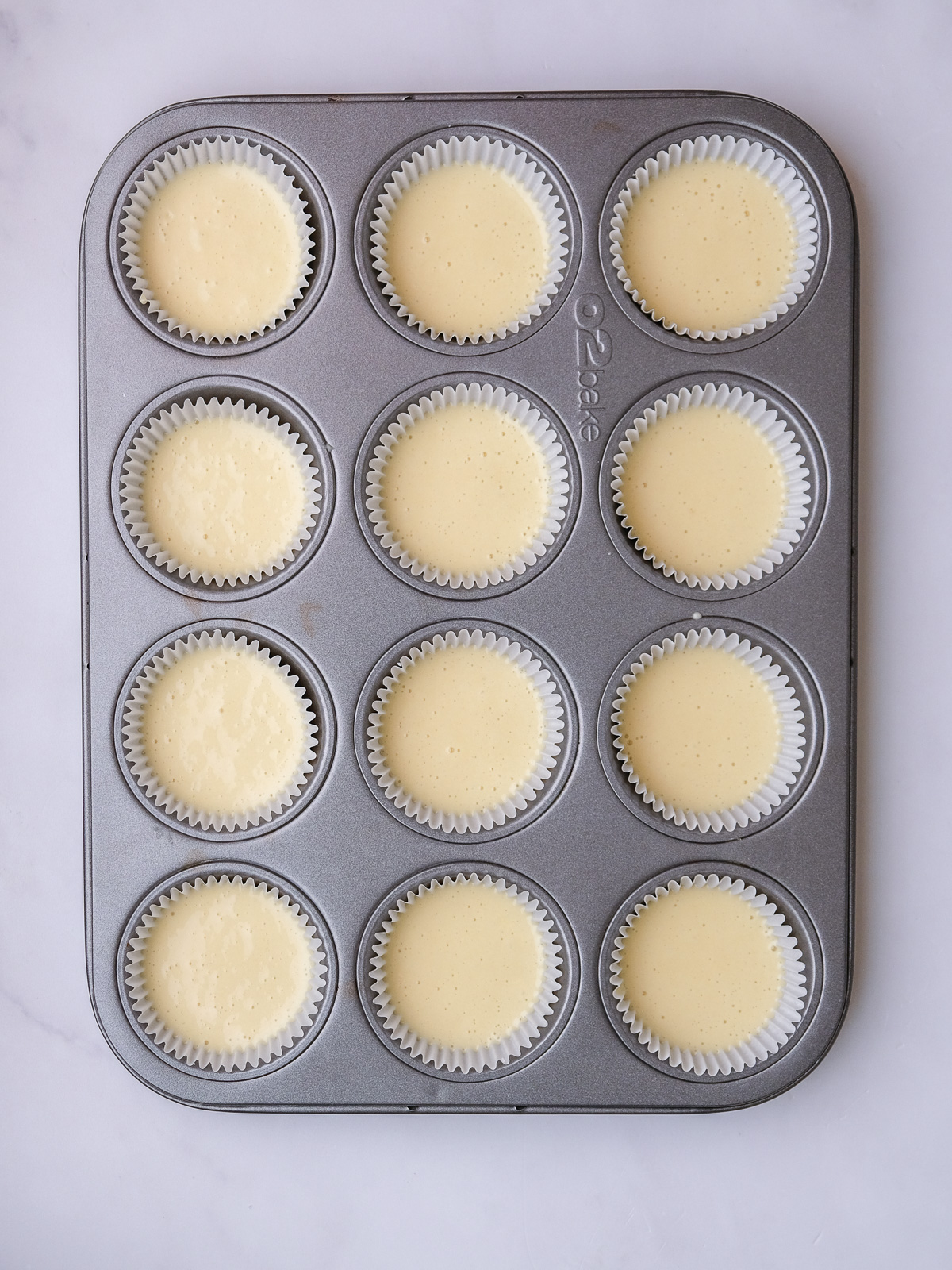 Image shows step 3 of how to make vanilla cupcakes for this peppermint crisp cupcake recipe.