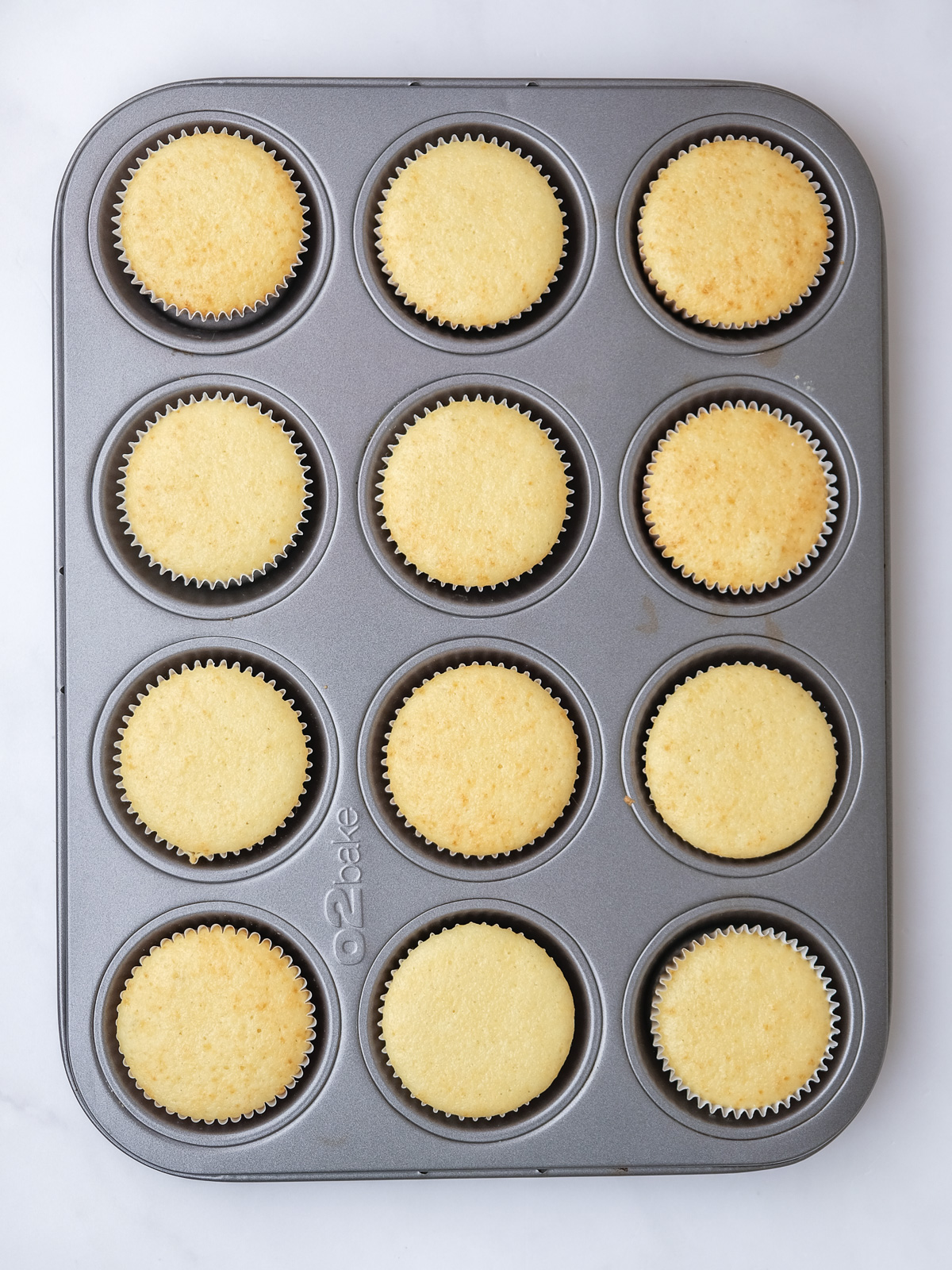 Image shows step 4 of how to make vanilla cupcakes for this peppermint crisp cupcake recipe.