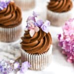 Chocolate cupcake with Lindt chocolate icing and flowers on top of the cupcake