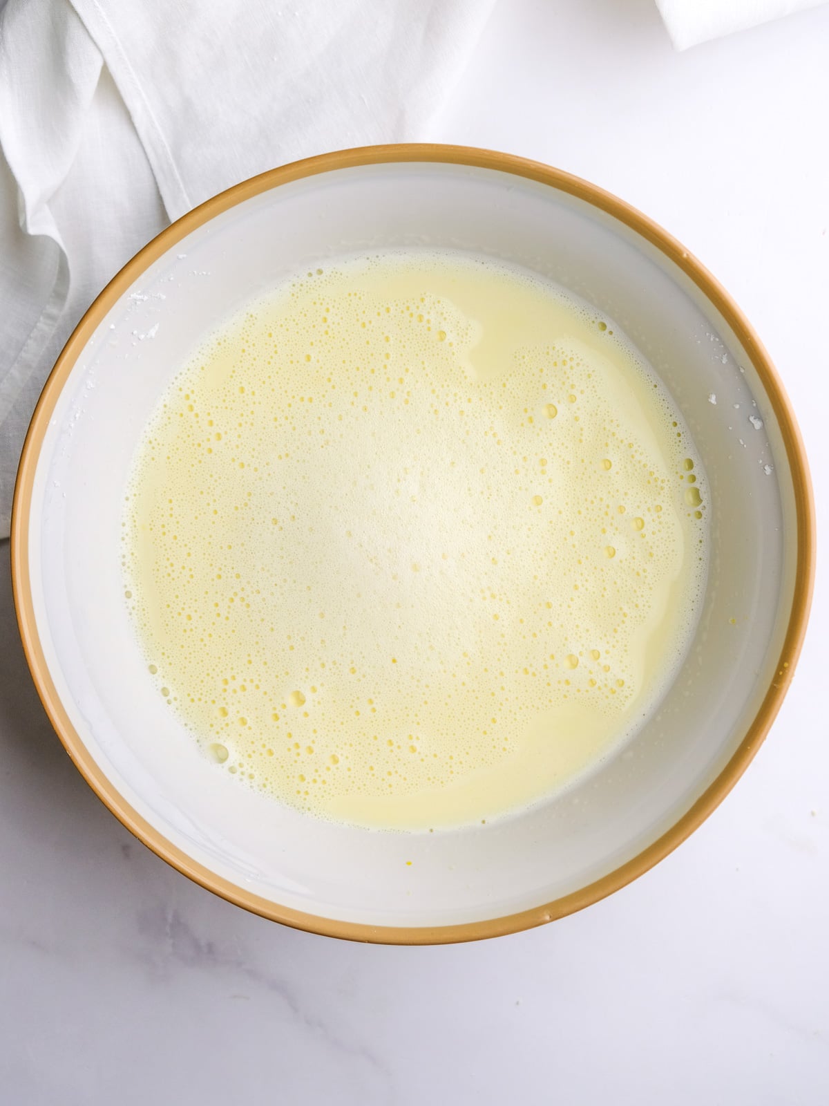 Image shows step 3 of how to make the custard filling.