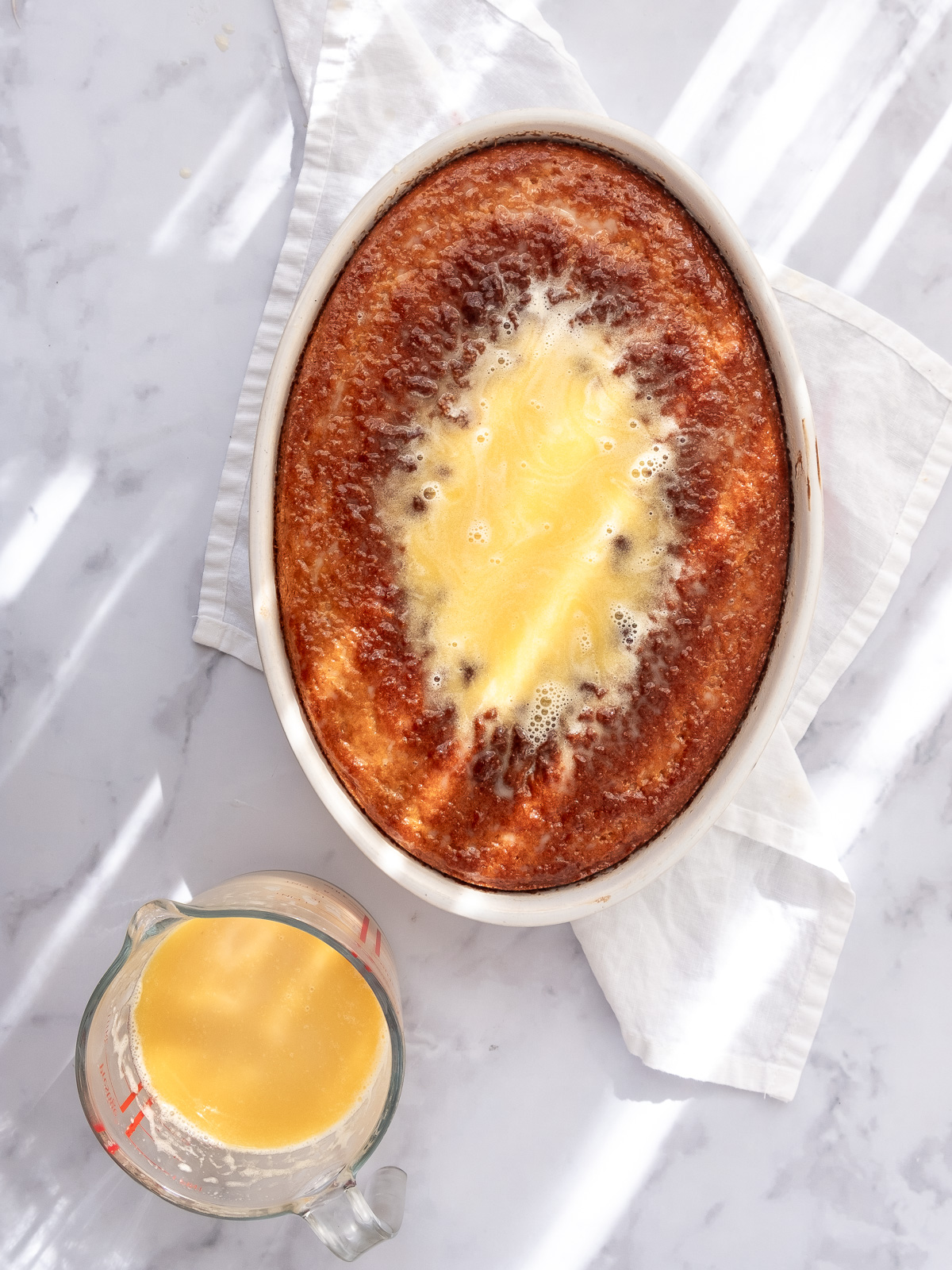 Image shows step 6 of how to make a malva pudding.