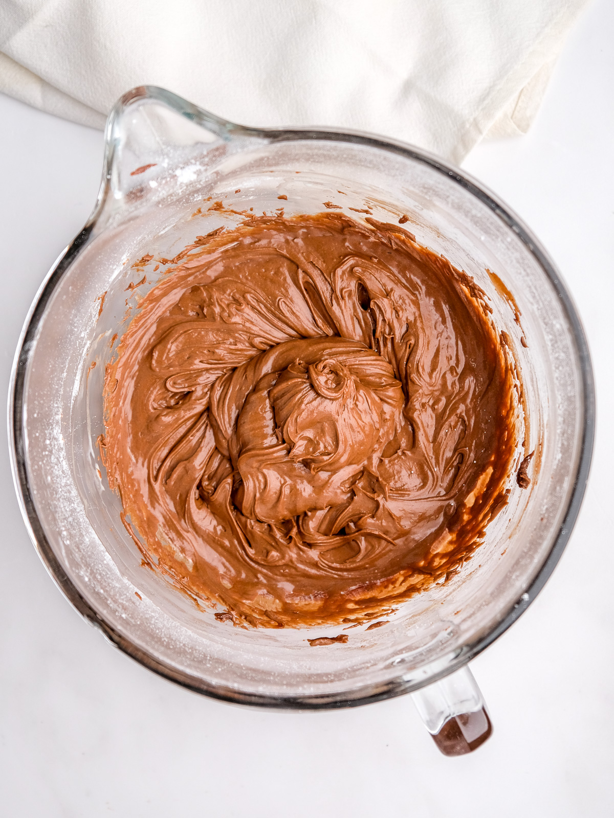Image shows step 4 of how to make a chocolate buttercream.