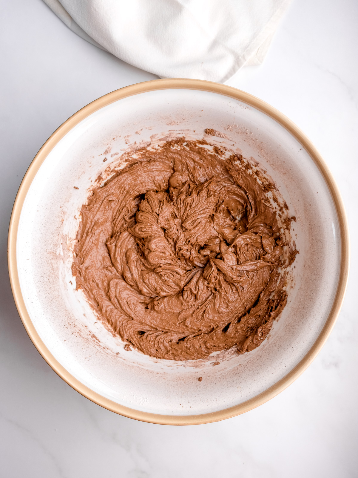 Image shows step 3 of how to make a moist chocolate cake.