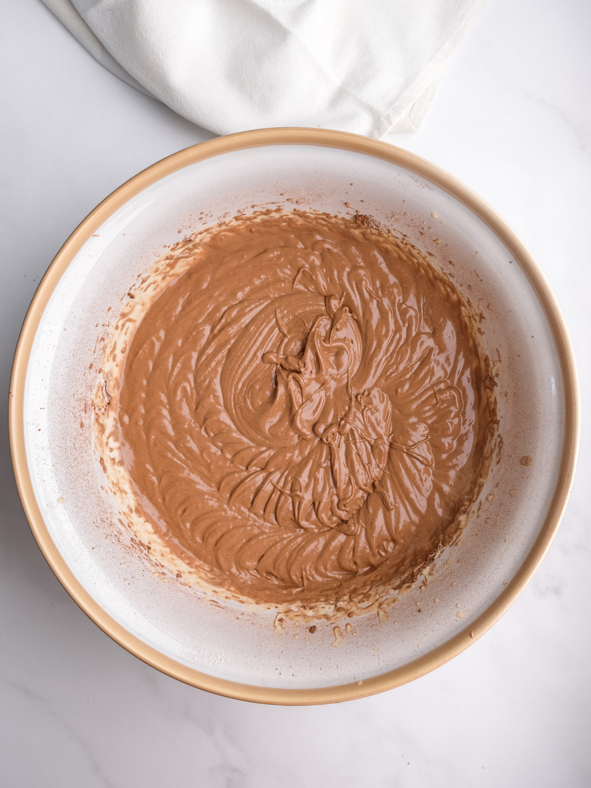 Image shows step 4 of how to make a moist chocolate cake.