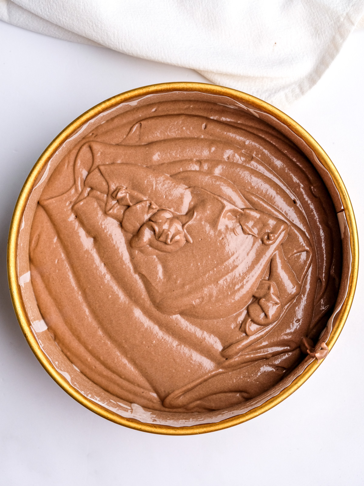 Image shows step 5 of how to make a moist chocolate cake.
