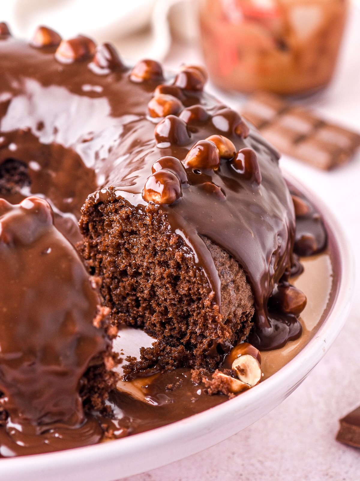 Image shows the cake with a slice missing so that you can see the moist texture inside of the cake.