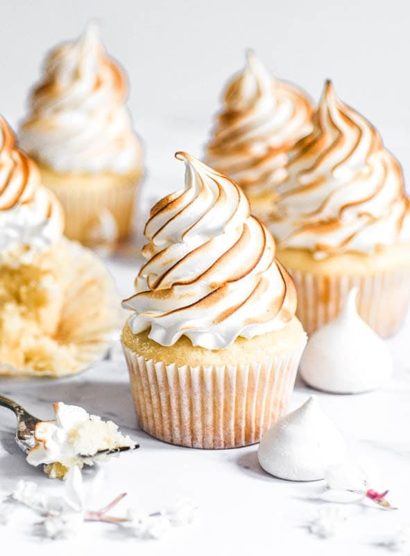 Lemon Meringue Cupcakes shown on a kitchen counter. 