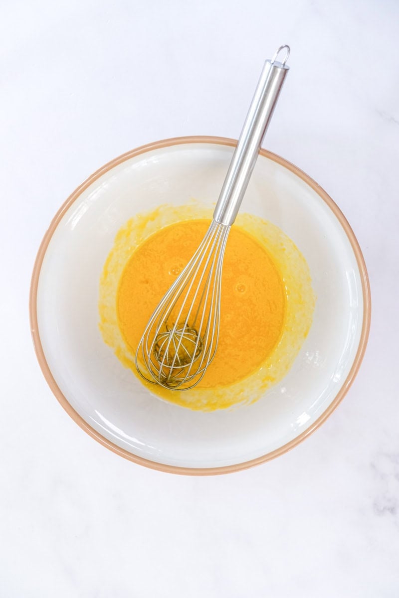 Image showing step 1 of how to make a white chocolate creme brulee.