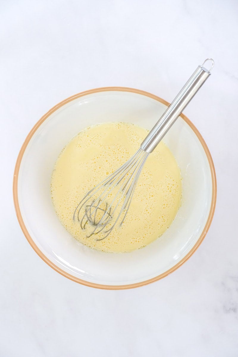 Image showing step 3 of how to make a white chocolate creme brulee.