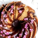 Chocolate Orange Cake shown from above with purple flowers