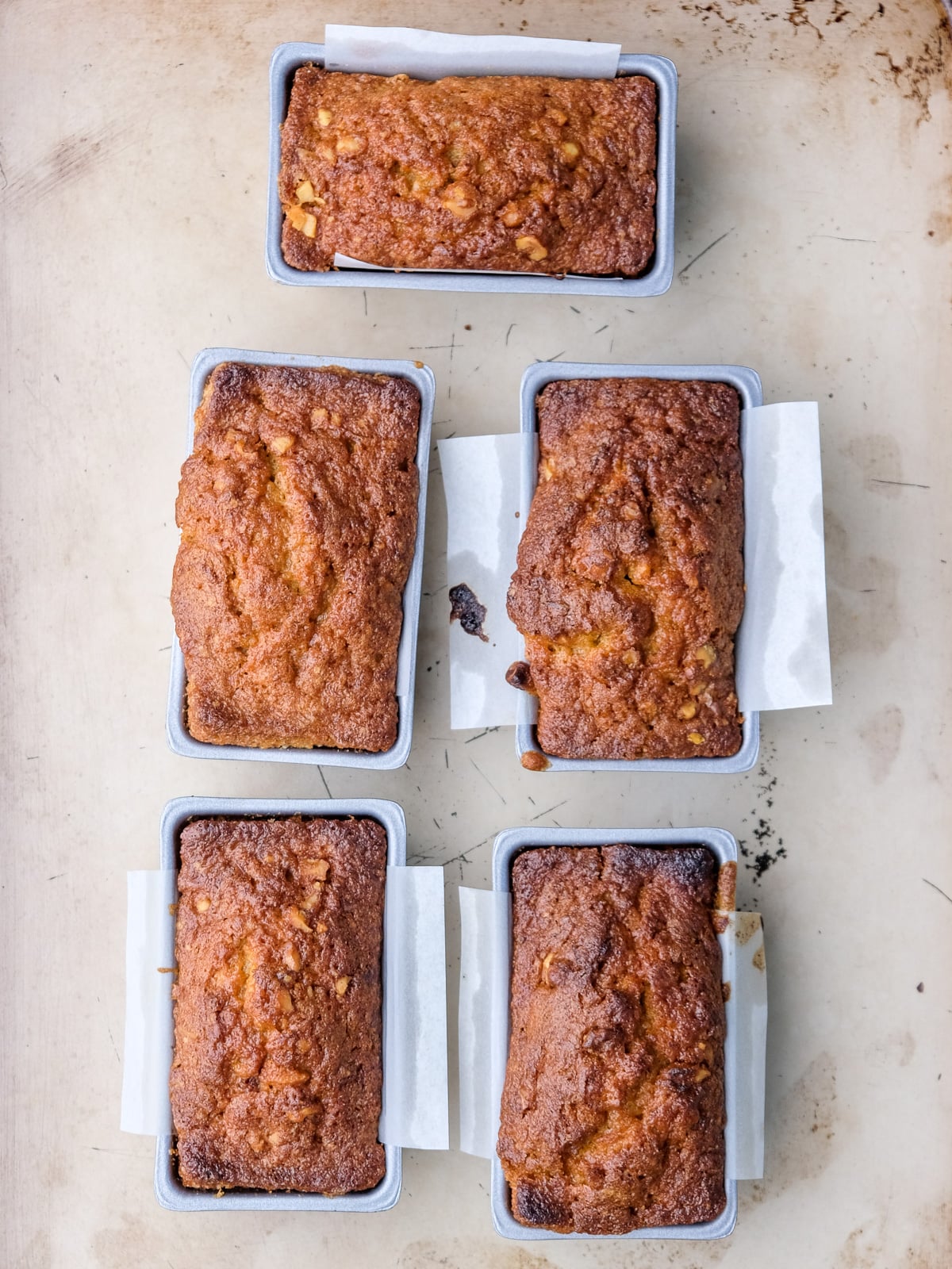 Image shows step 4 of how to make mini carrot loaf cakes.