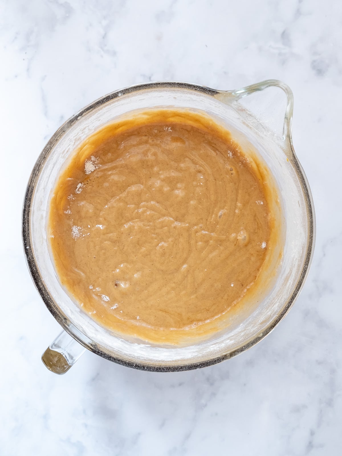 Image shows step 2 of how to make mini carrot loaf cakes.