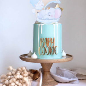 Baby Shower Cake for a Boy on a cake stand with and elephant cake topper