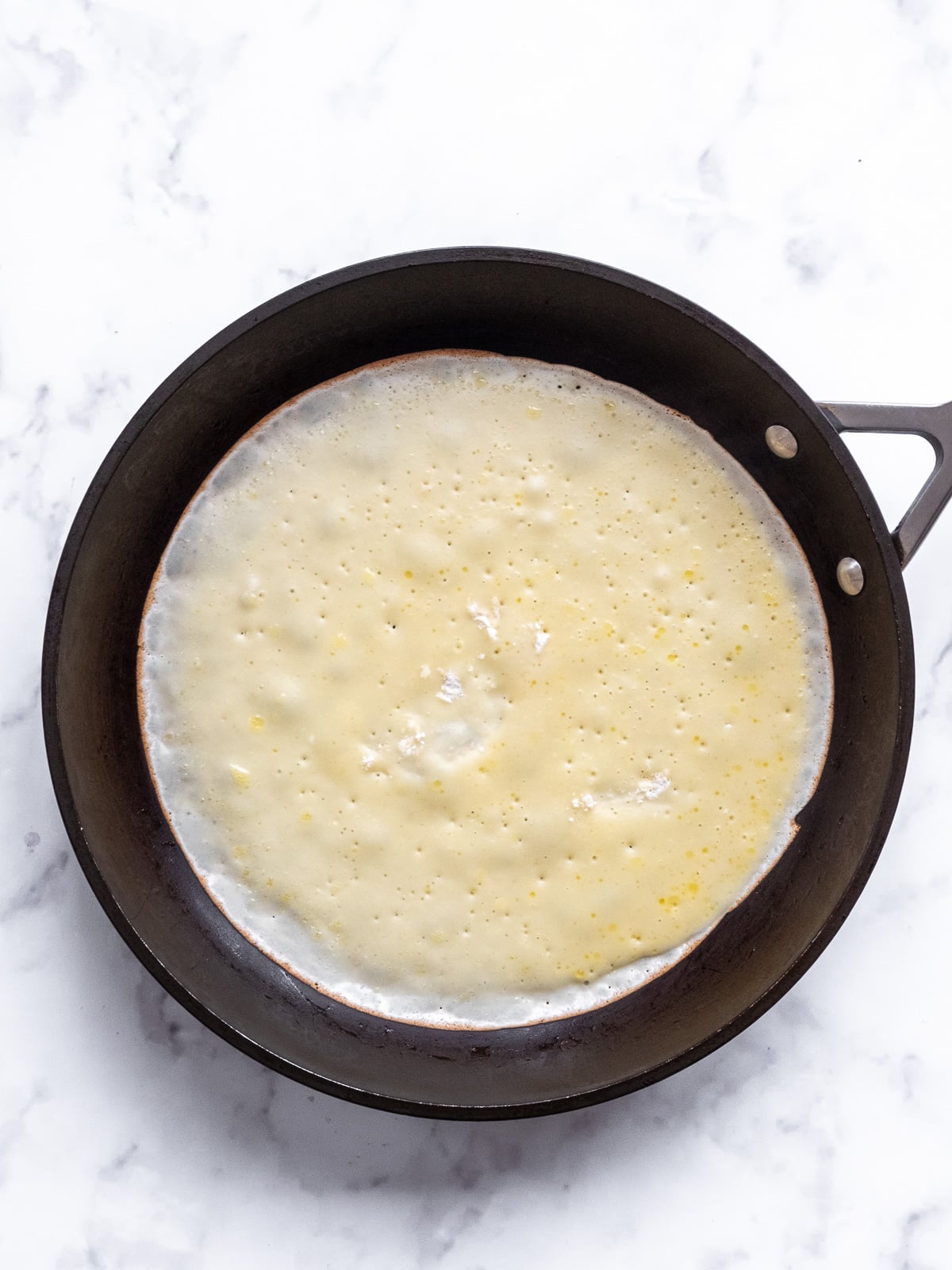 Image shows step 3 of how to make South African pancakes.