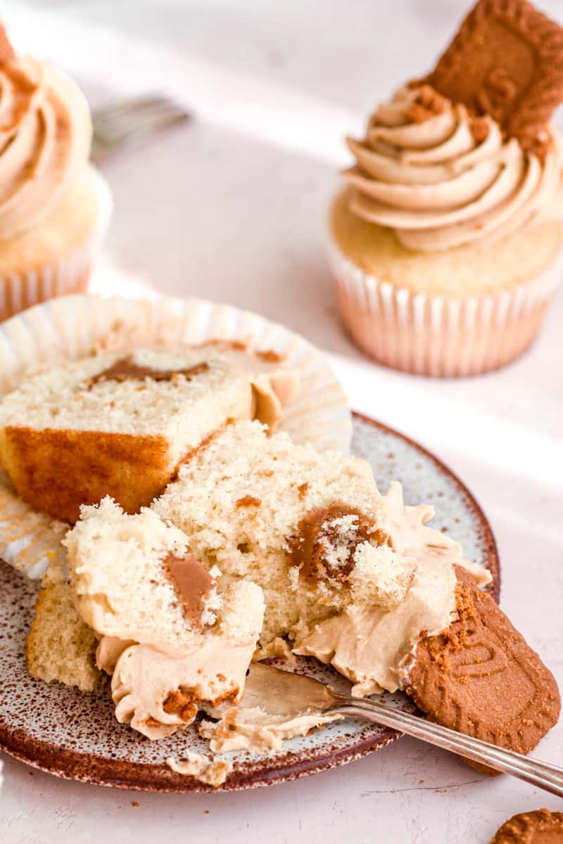 Biscoff Cupcake shown sliced open on a plate.