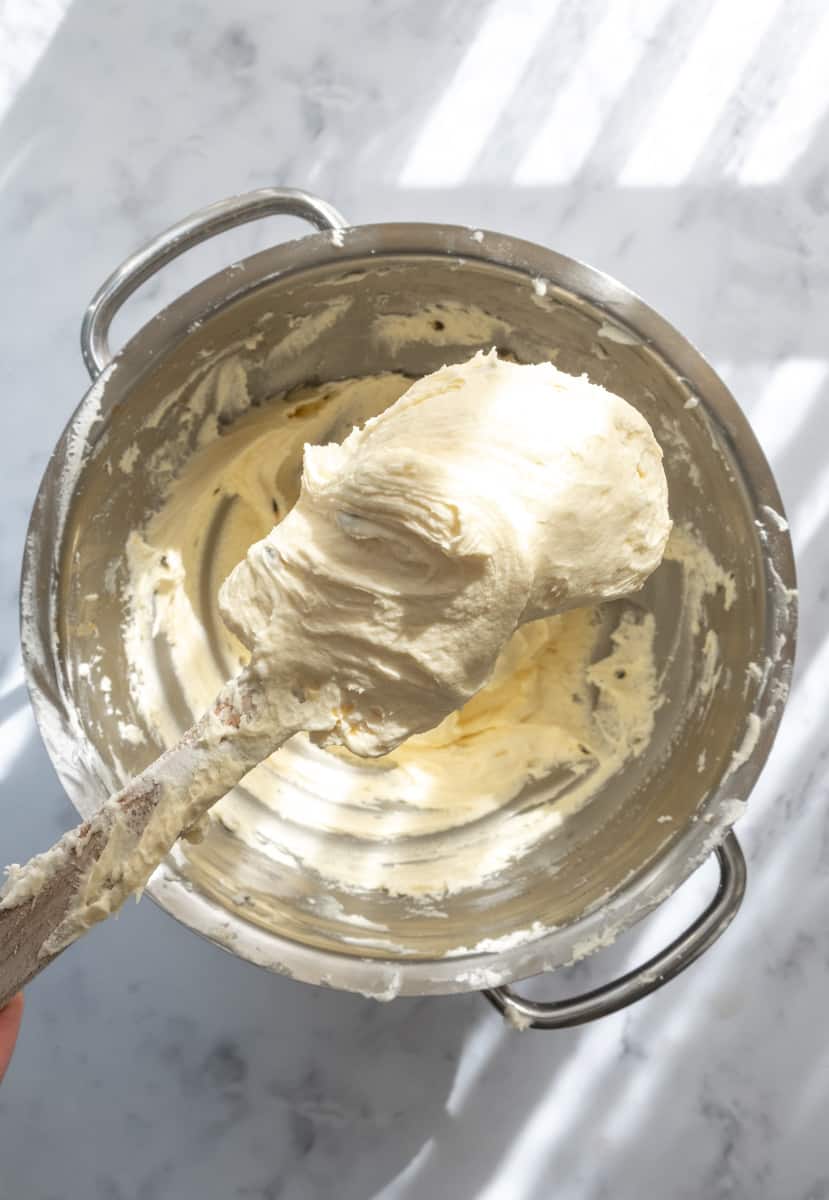Passionfruit Cupcakes Frosting on a spatula 
