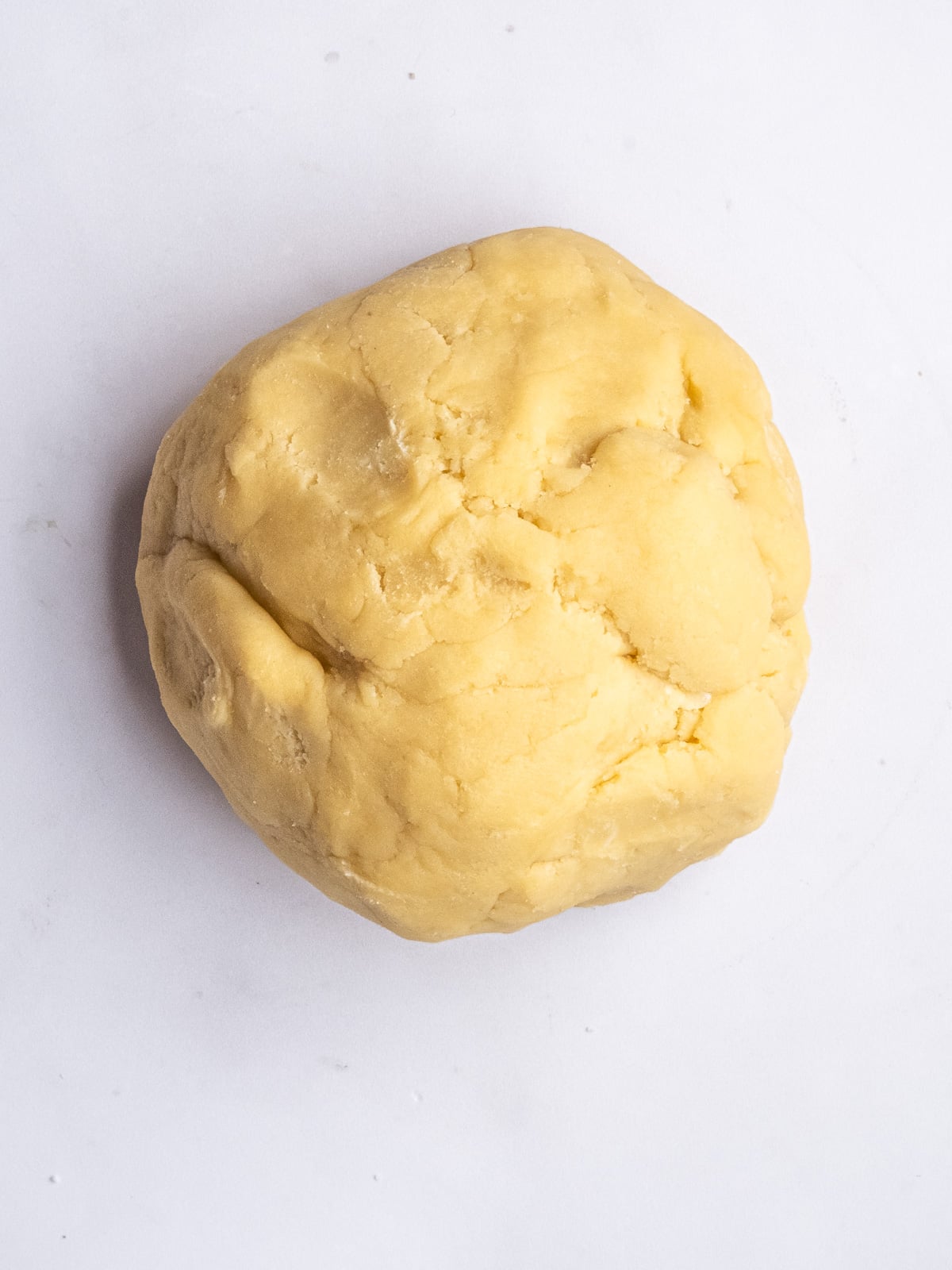 Image shows step 4 of how to make the crumble pastry.