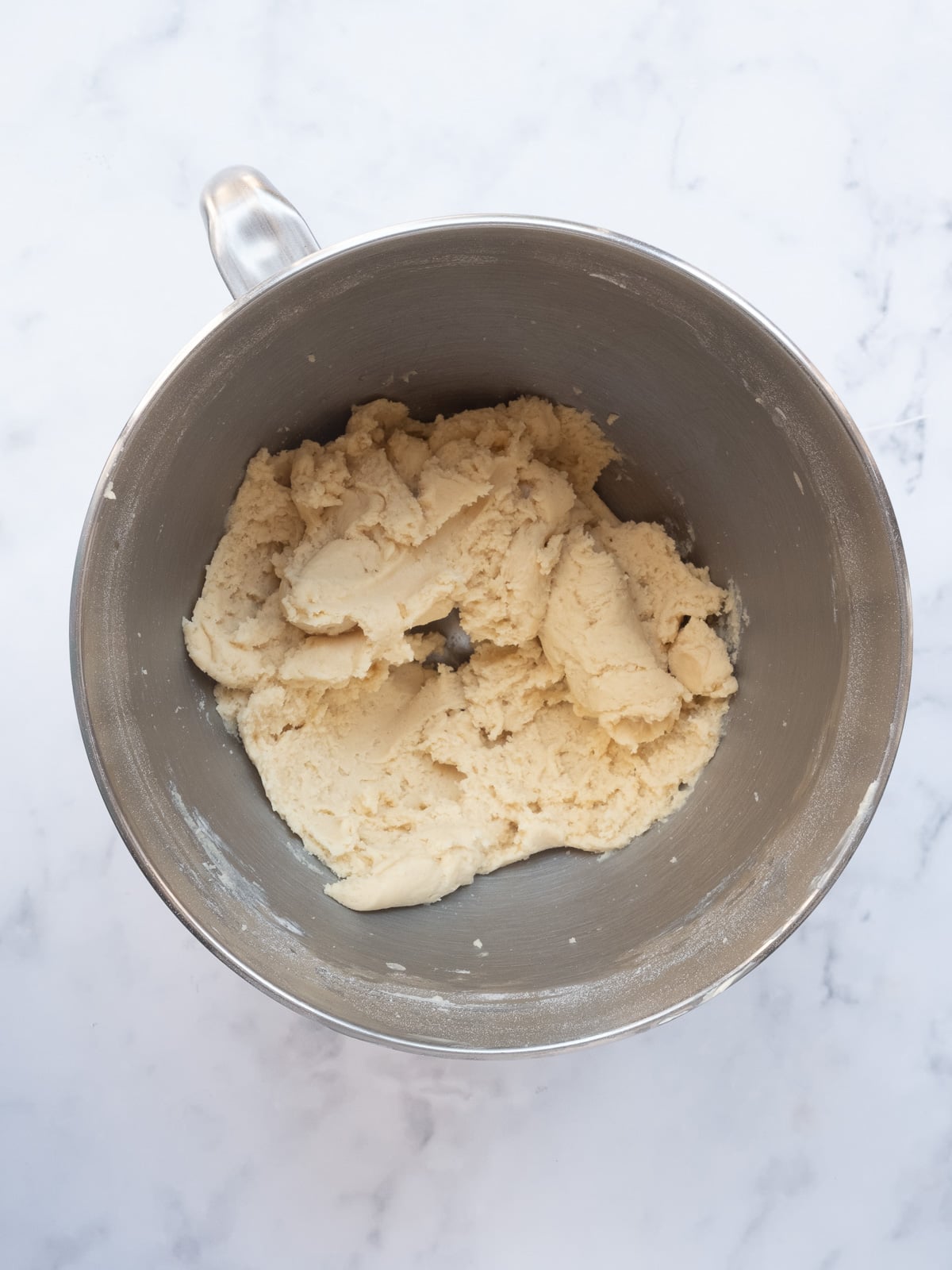 Image shows step 3 of how to make the crumble pastry.