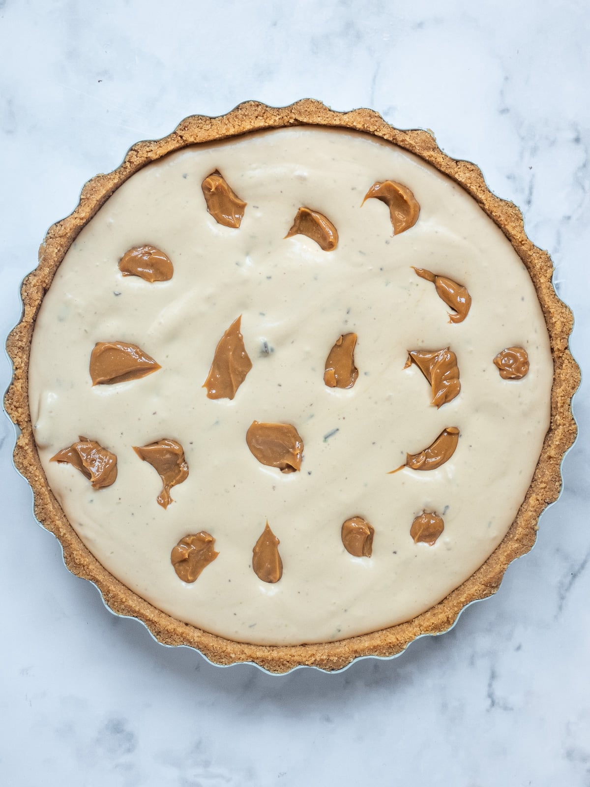 Image shows filled biscuit base before freezing.