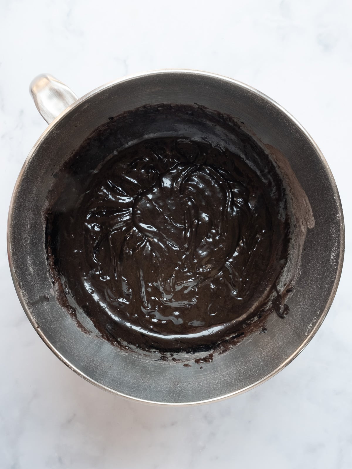 Image shows step 3 of how to make black velvet cupcakes.