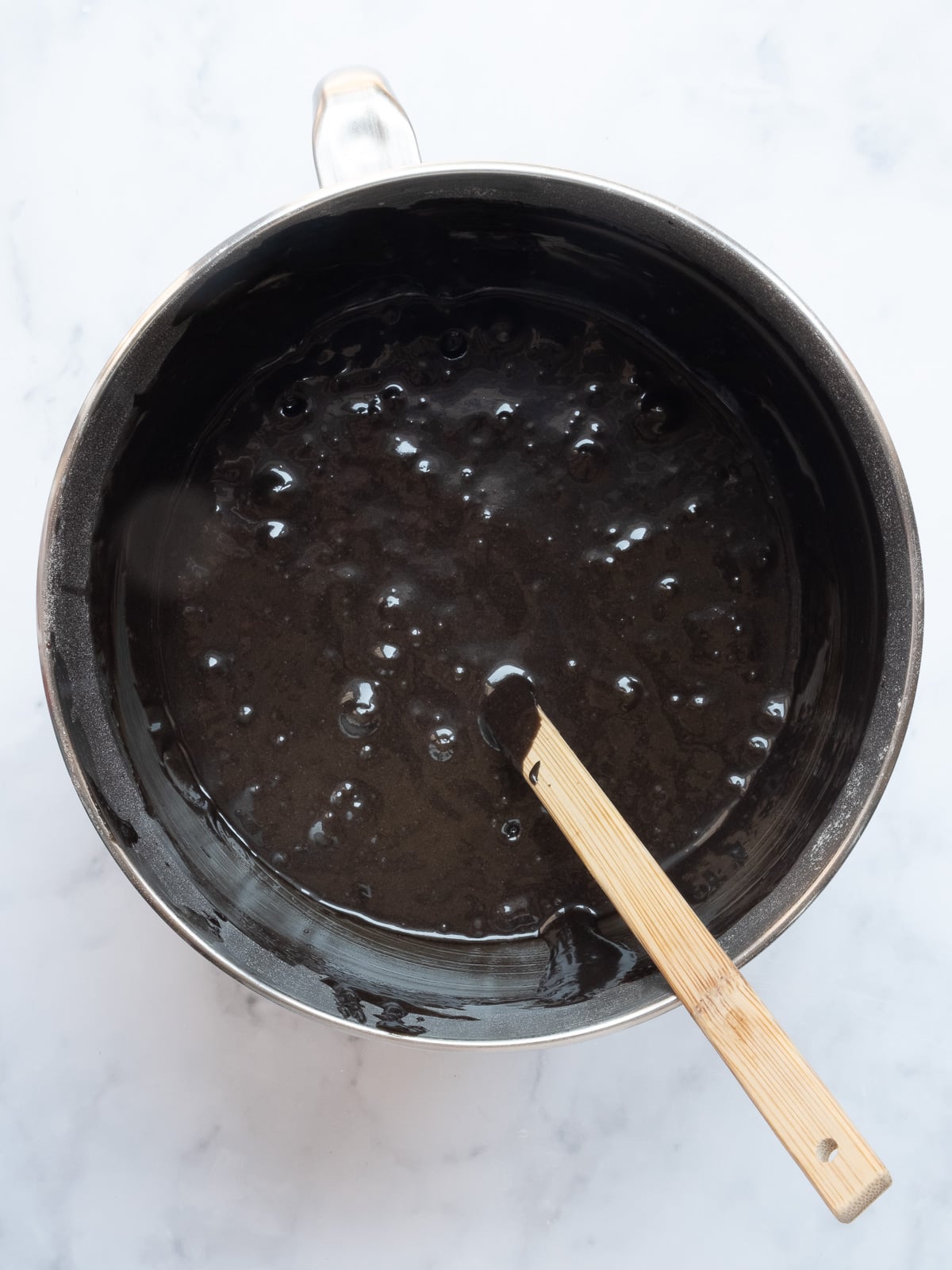 Image shows step 4 of how to make black velvet cupcakes.