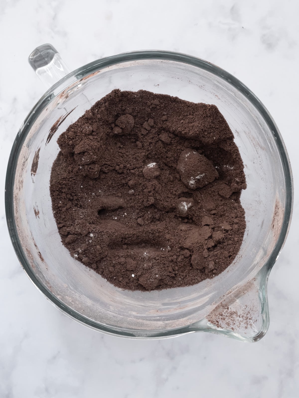 Image shows step 2 of how to make black buttercream frosting.