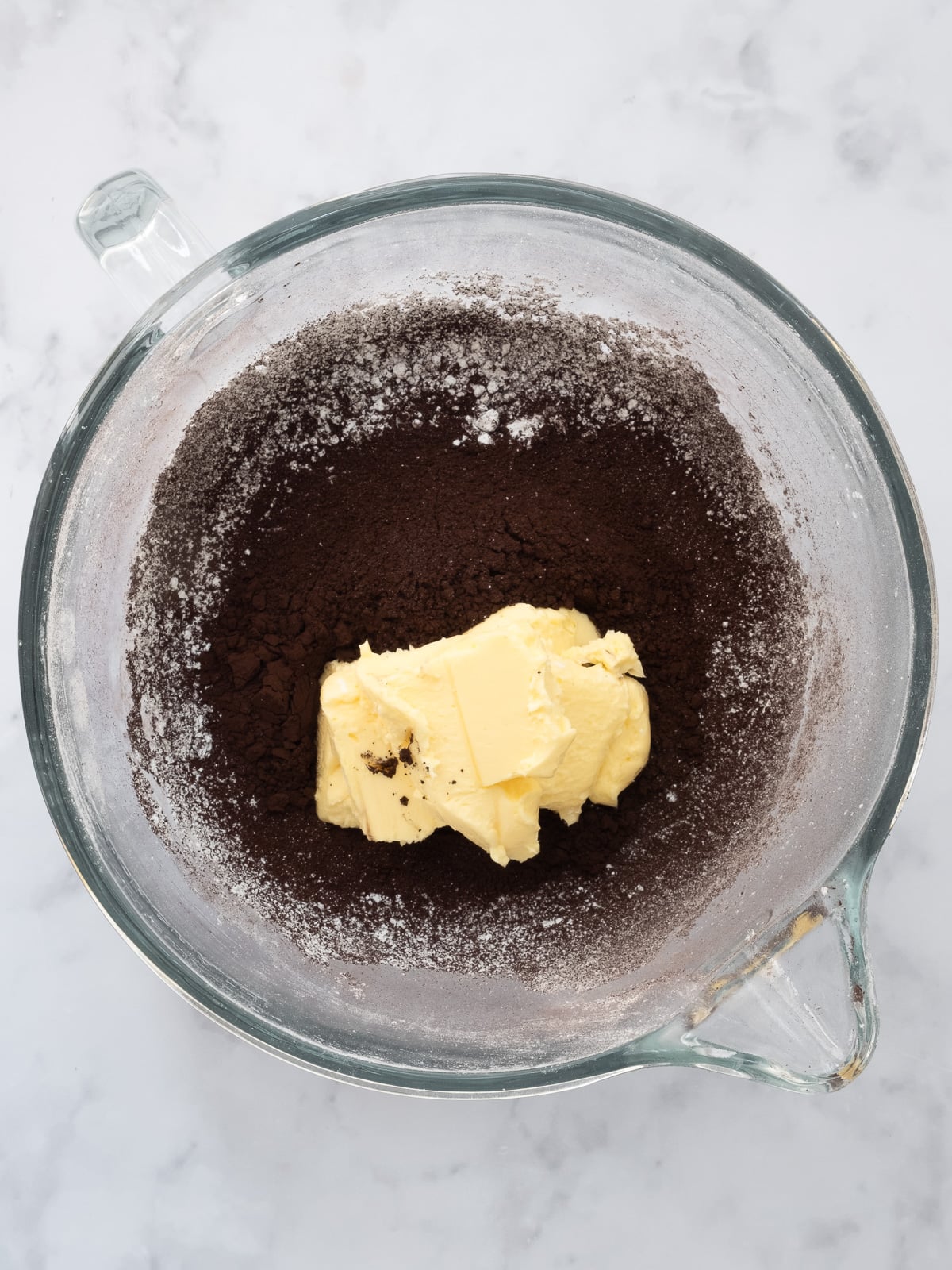 Image shows step 1 of how to make black buttercream frosting.