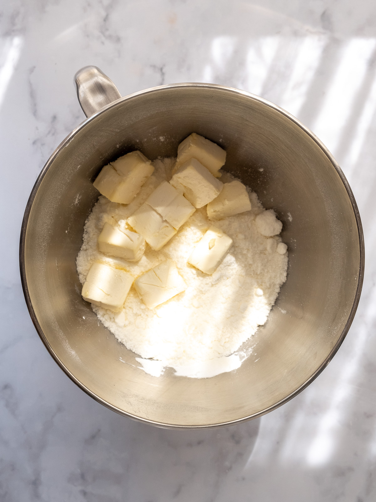 Image shows step 1 of how to make this cream cheese frosting for pumpkin bread.