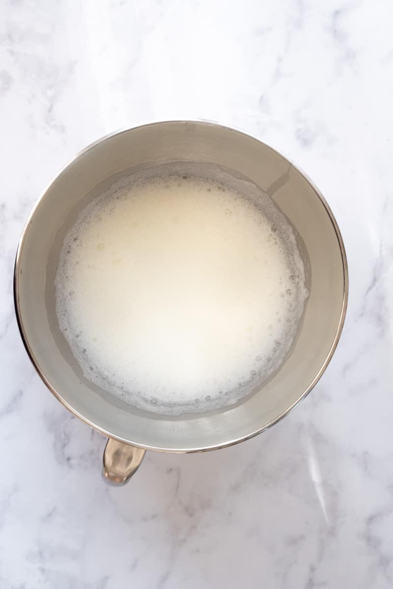 Image showing the end of step 3, the egg whites are now white and frothy. 