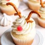 Reindeer cupcake shown on a white plate.