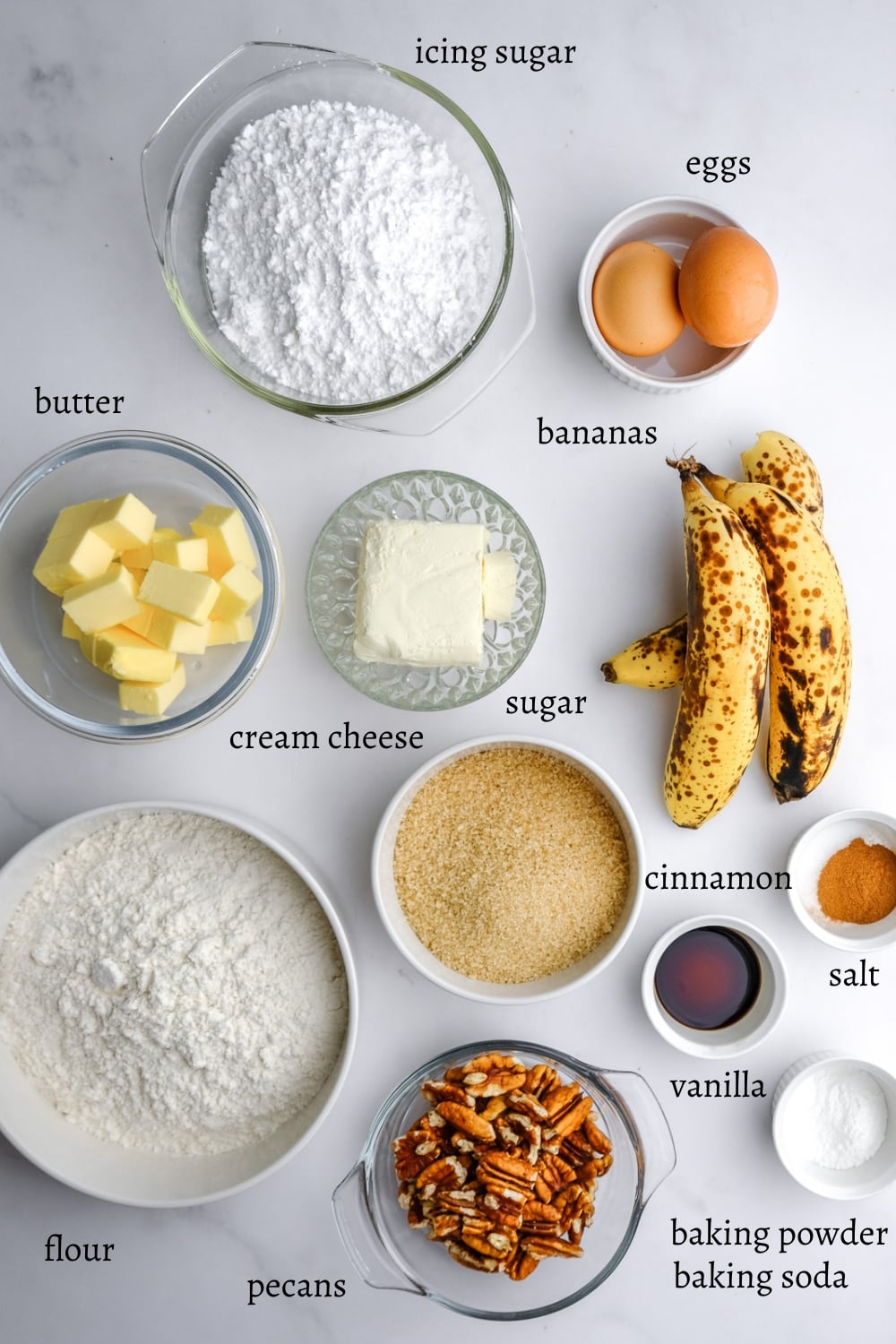 Image shows ingredients needed to make banana bread with cream cheese frosting.