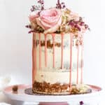 Naked Carrot Cake on a pink cake stand.