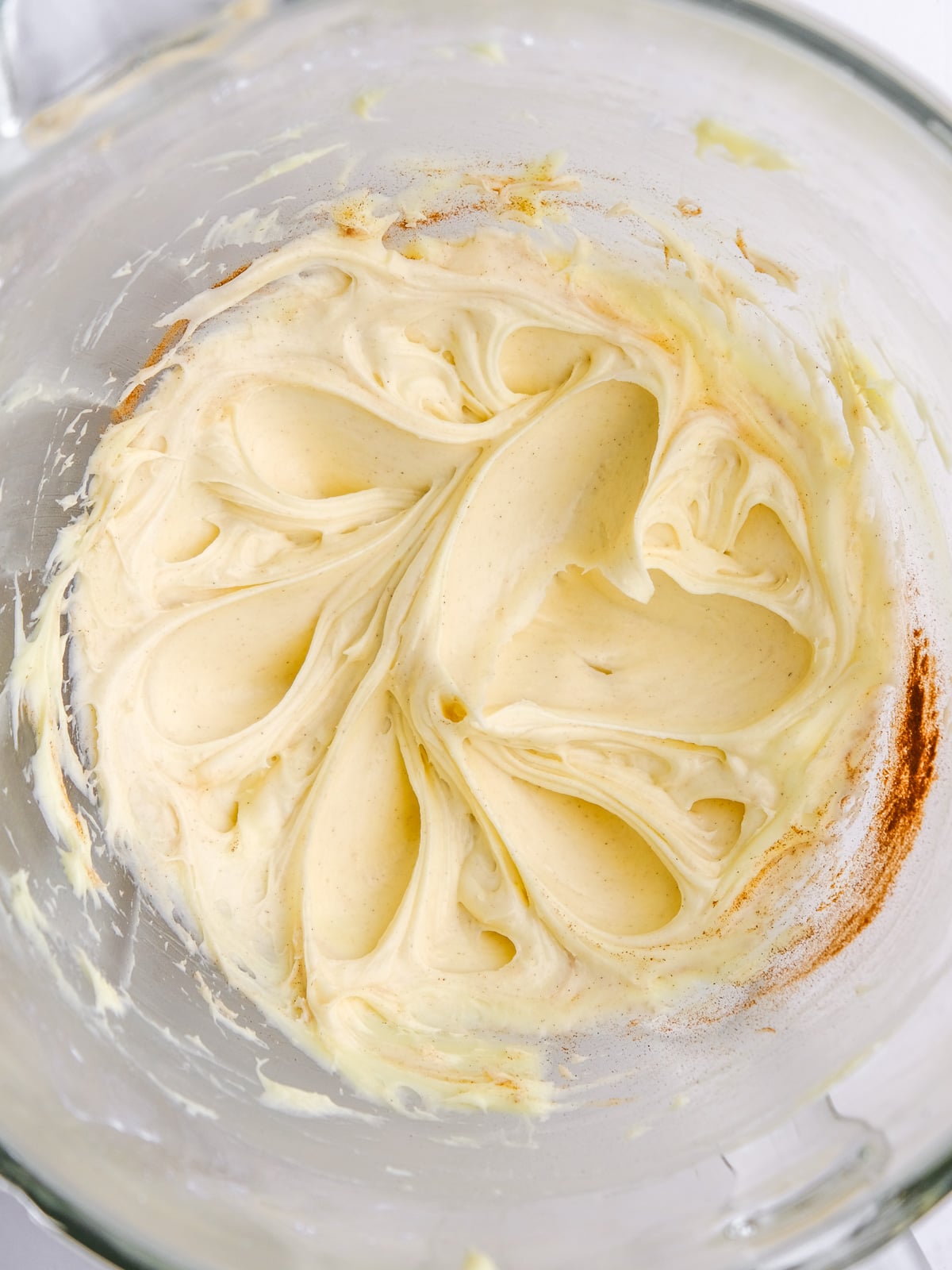 Image shows step 3 of how to make the cream cheese frosting.