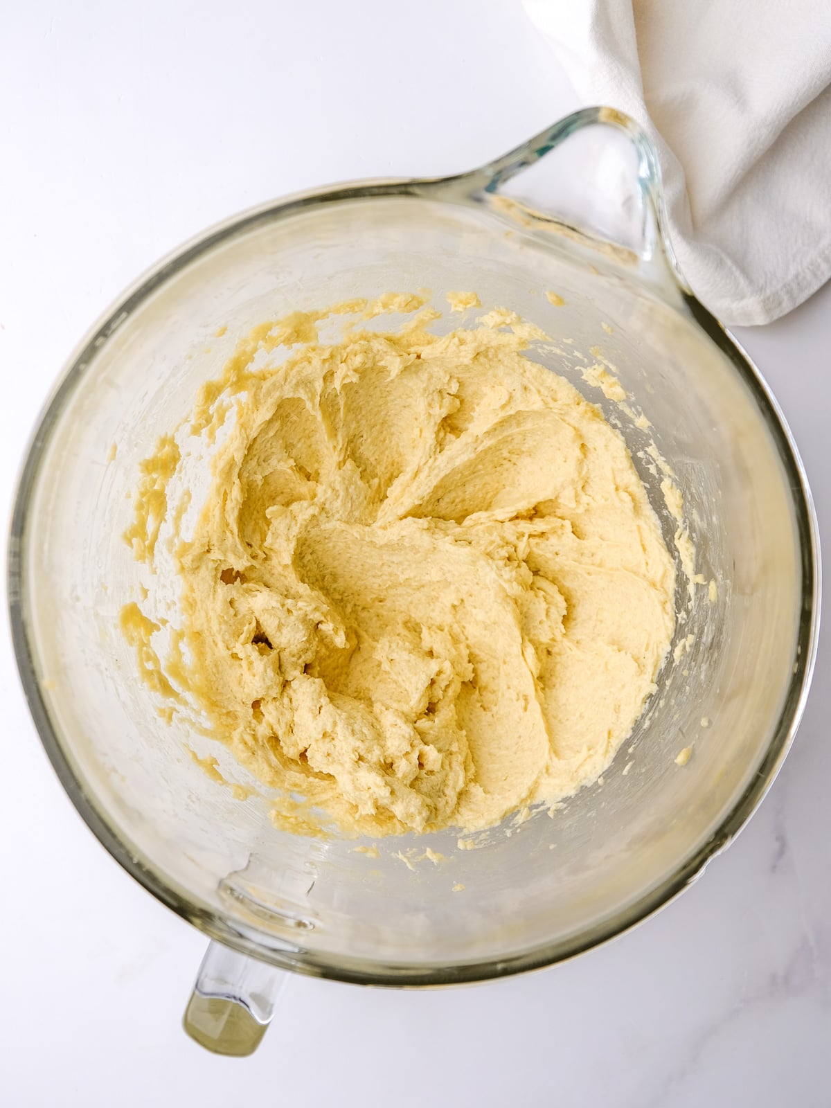 Image shows step 2 of how to make banana bread with cream cheese frosting.