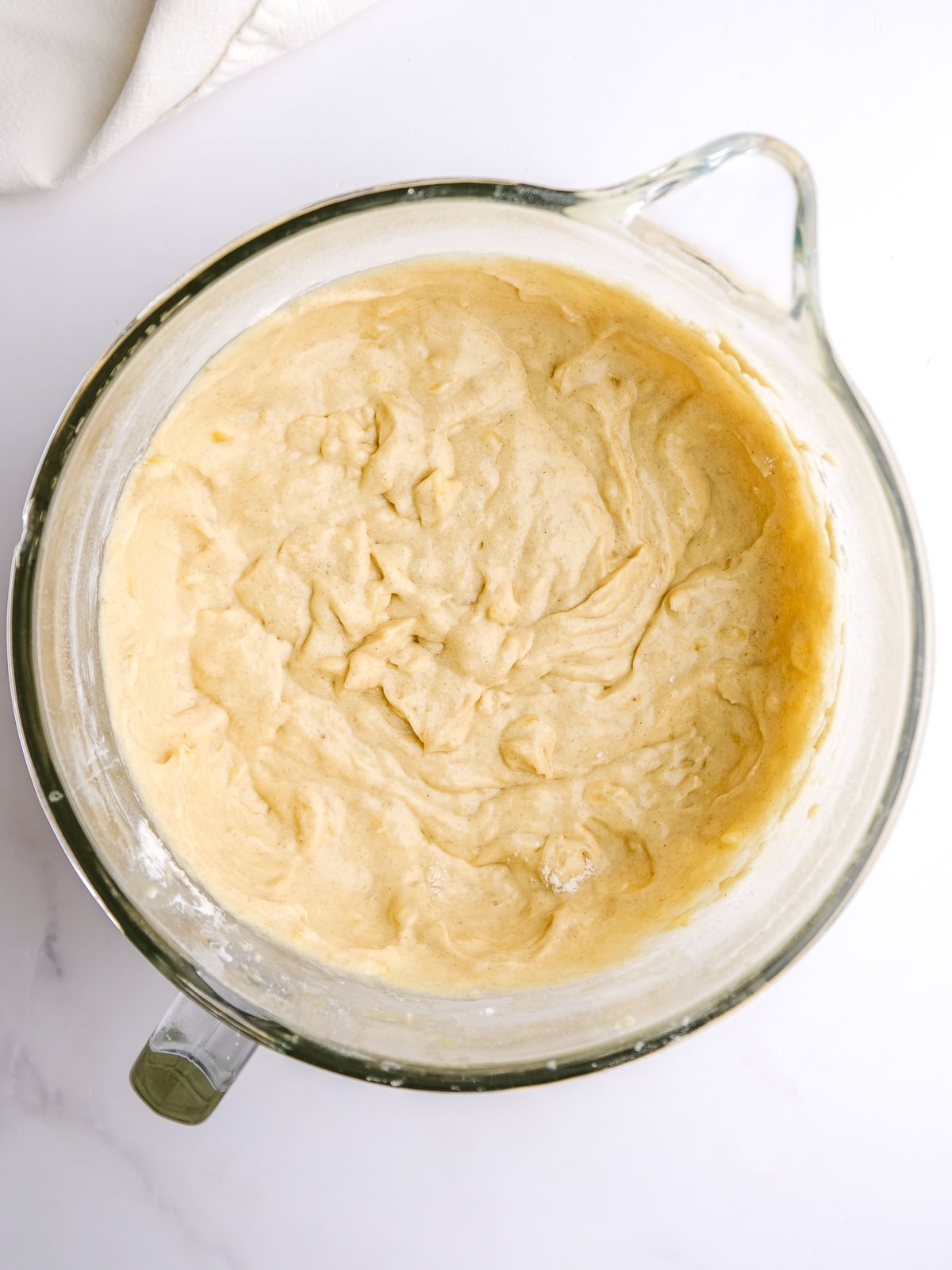 Image shows step 3 of how to make banana bread with cream cheese frosting.