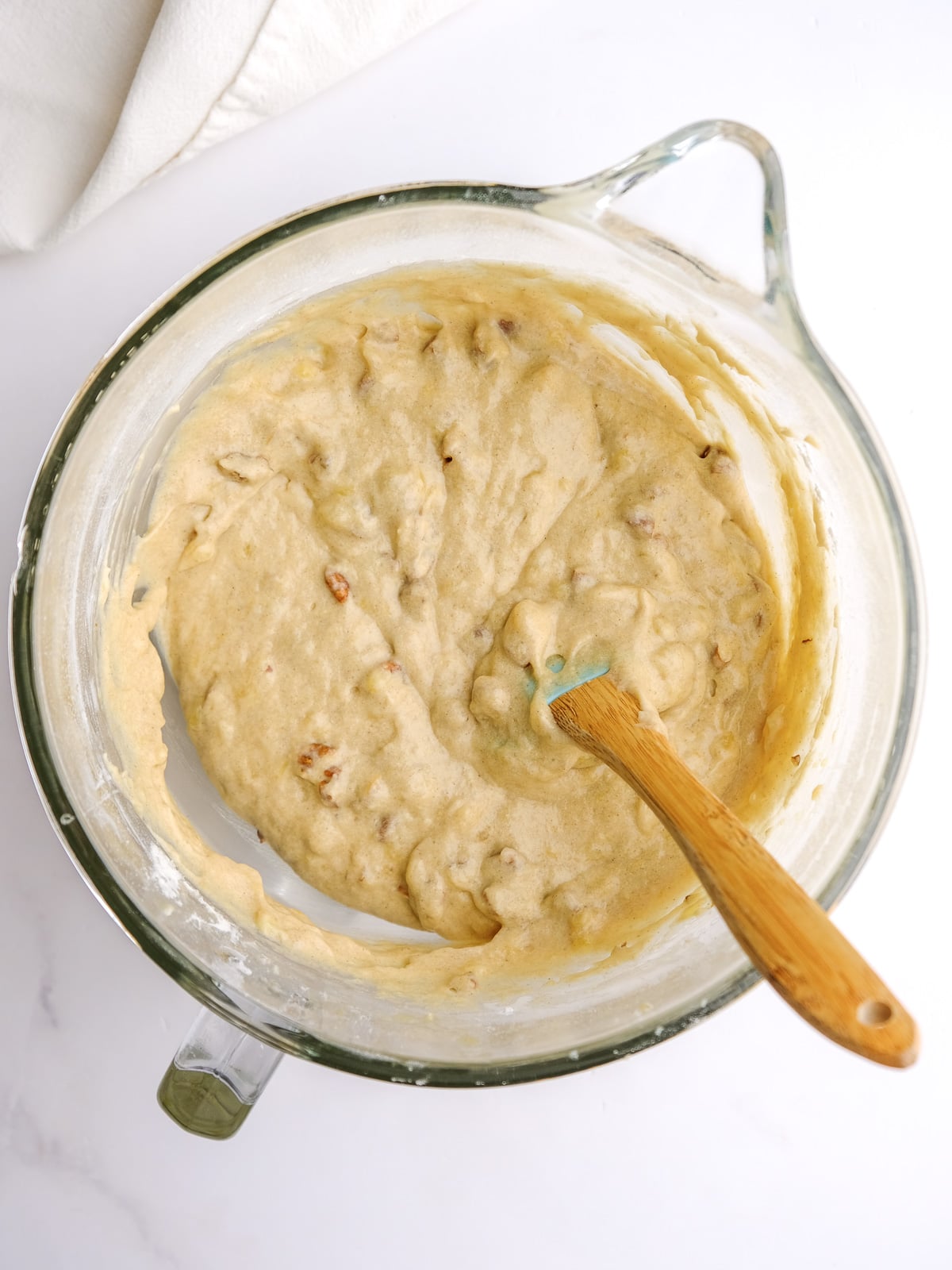 Image shows step 4 of how to make banana bread with cream cheese frosting.