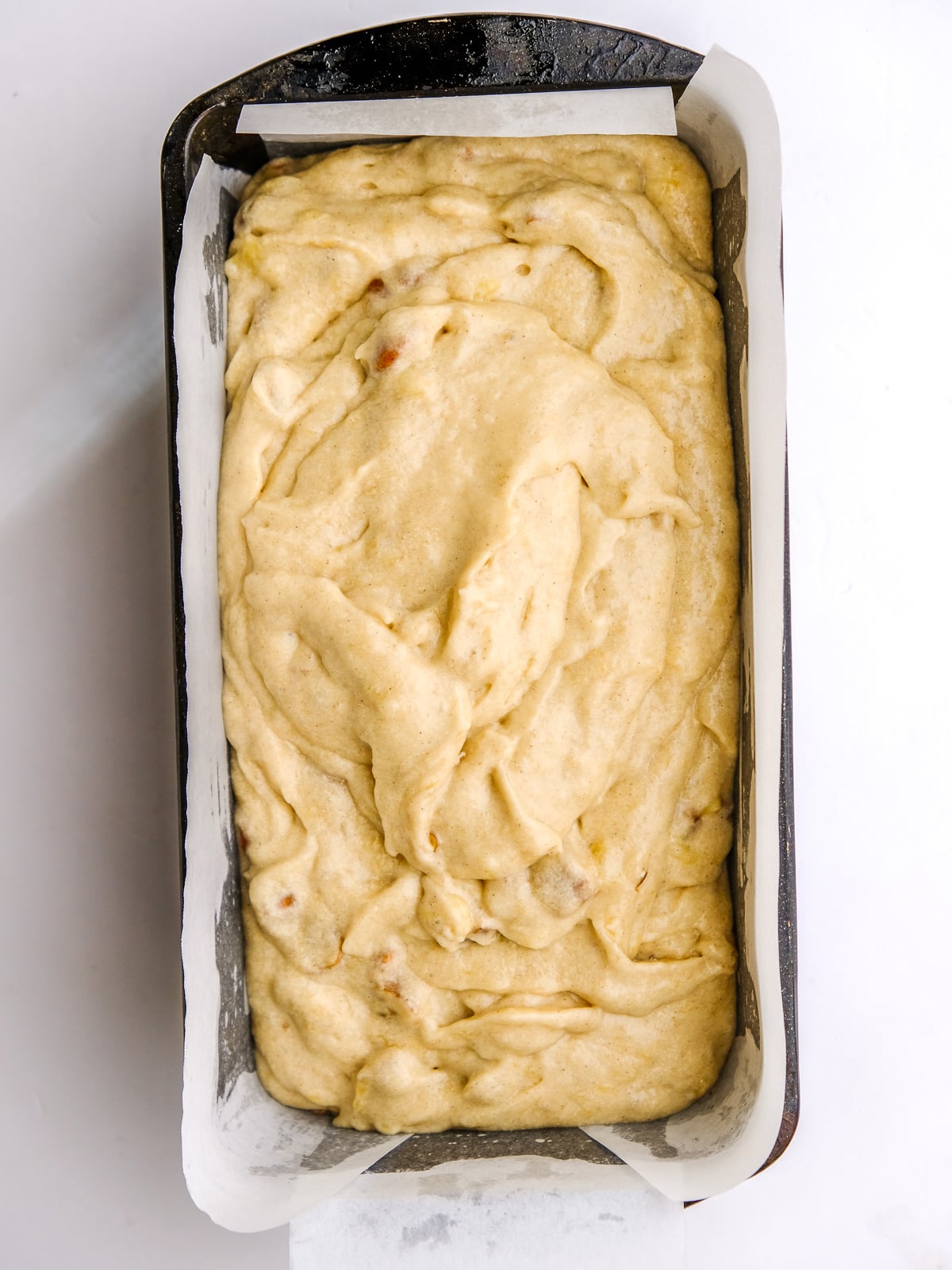 Image shows step 5 of how to make banana bread with cream cheese frosting.