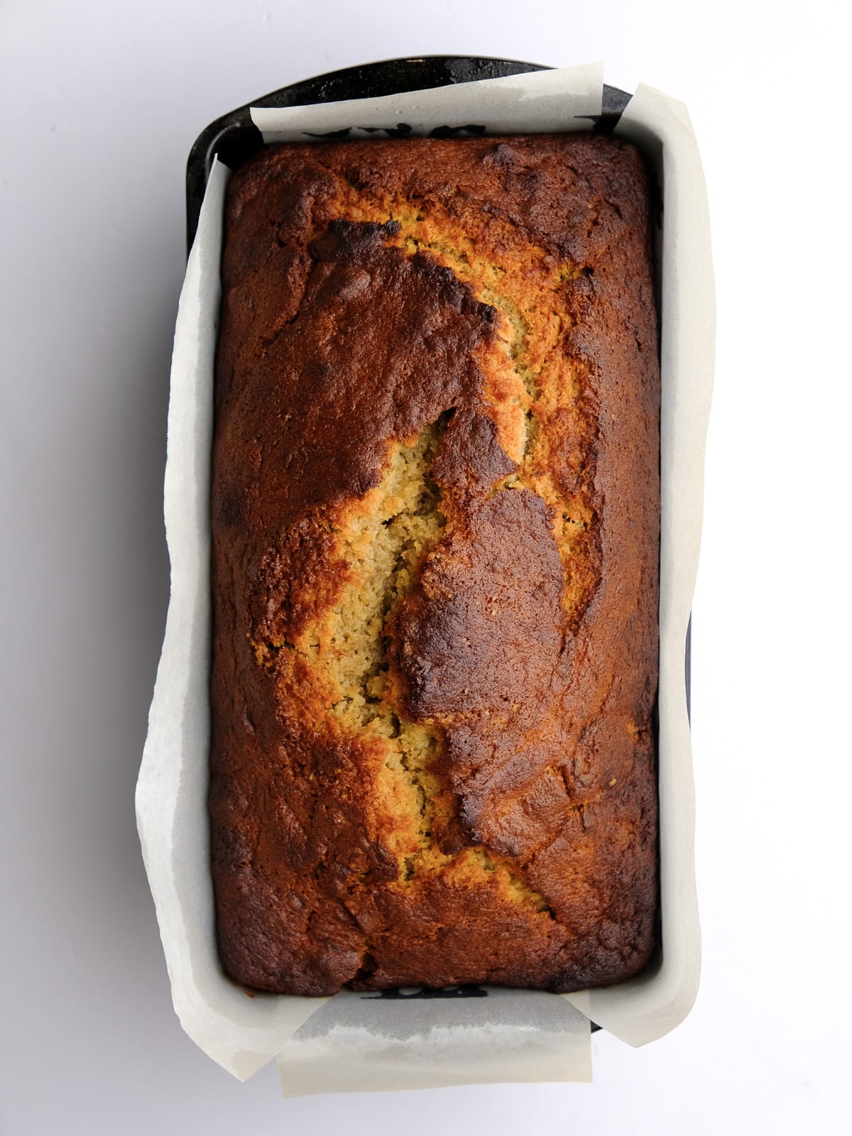 Image shows step 6 of how to make banana bread with cream cheese frosting.