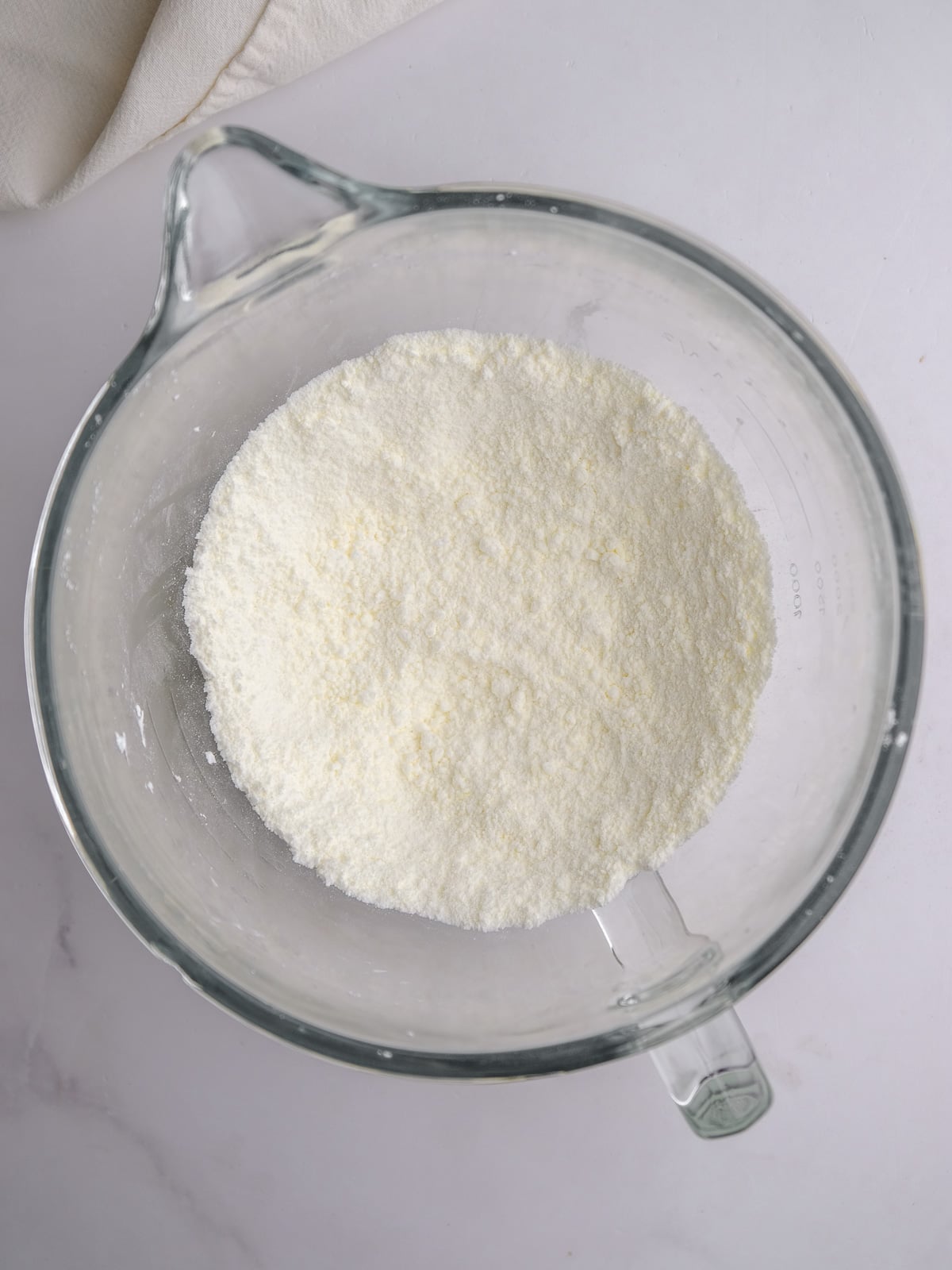 Image shows step 1 of how to make the cream cheese frosting.