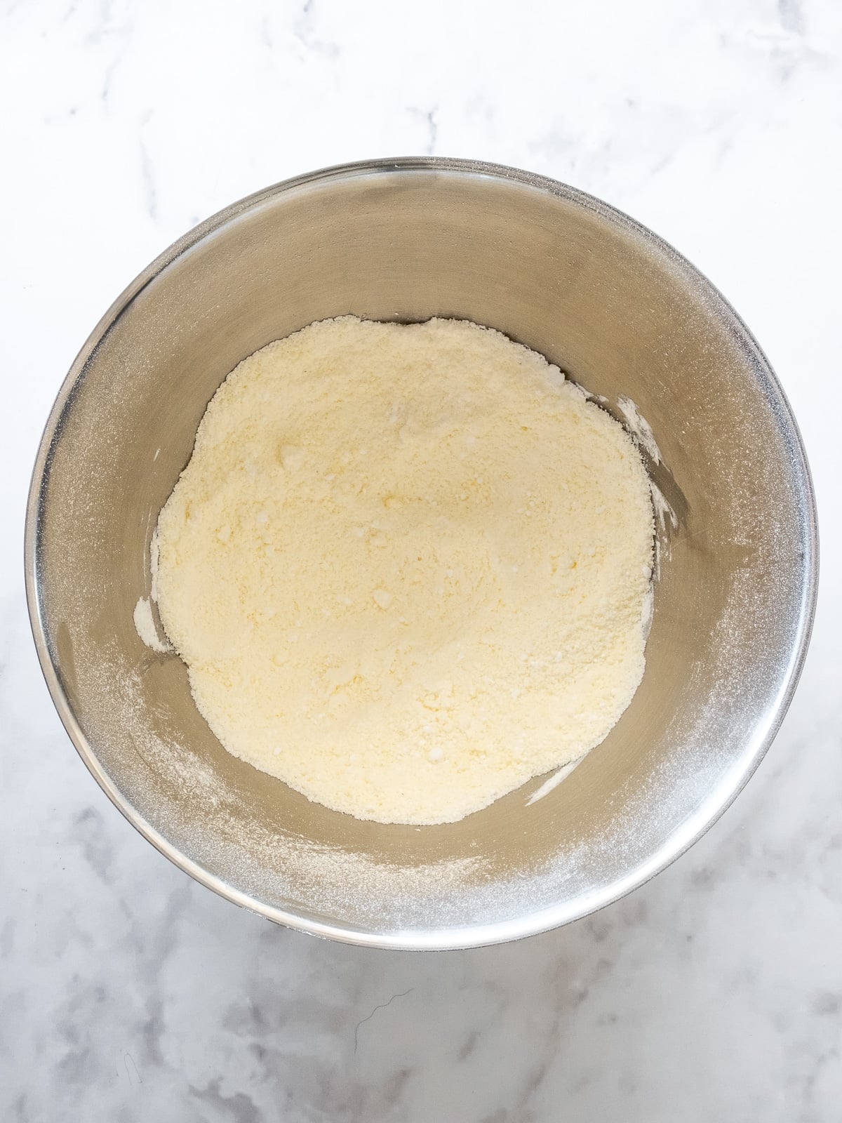 Step 1 showing how to make cinnamon cream cheese frosting.