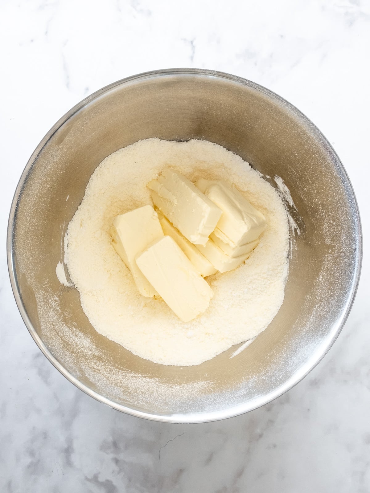 Step 2 showing how to make cinnamon cream cheese frosting.