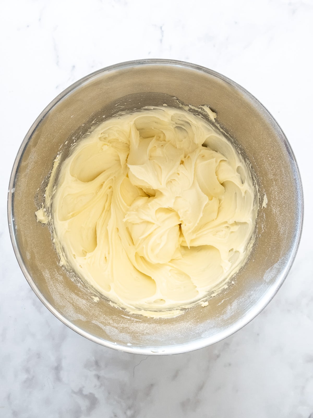 Step 3 showing how to make cinnamon cream cheese frosting.