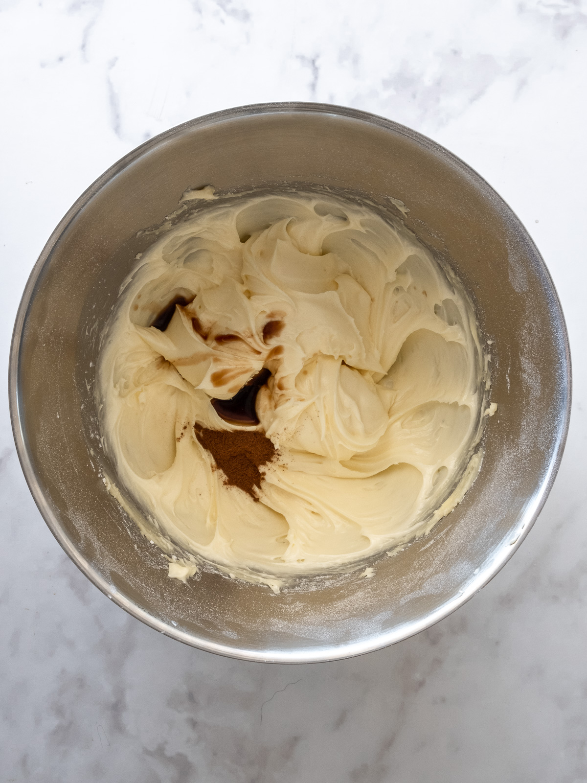 Step 4 showing how to make cinnamon cream cheese frosting.
