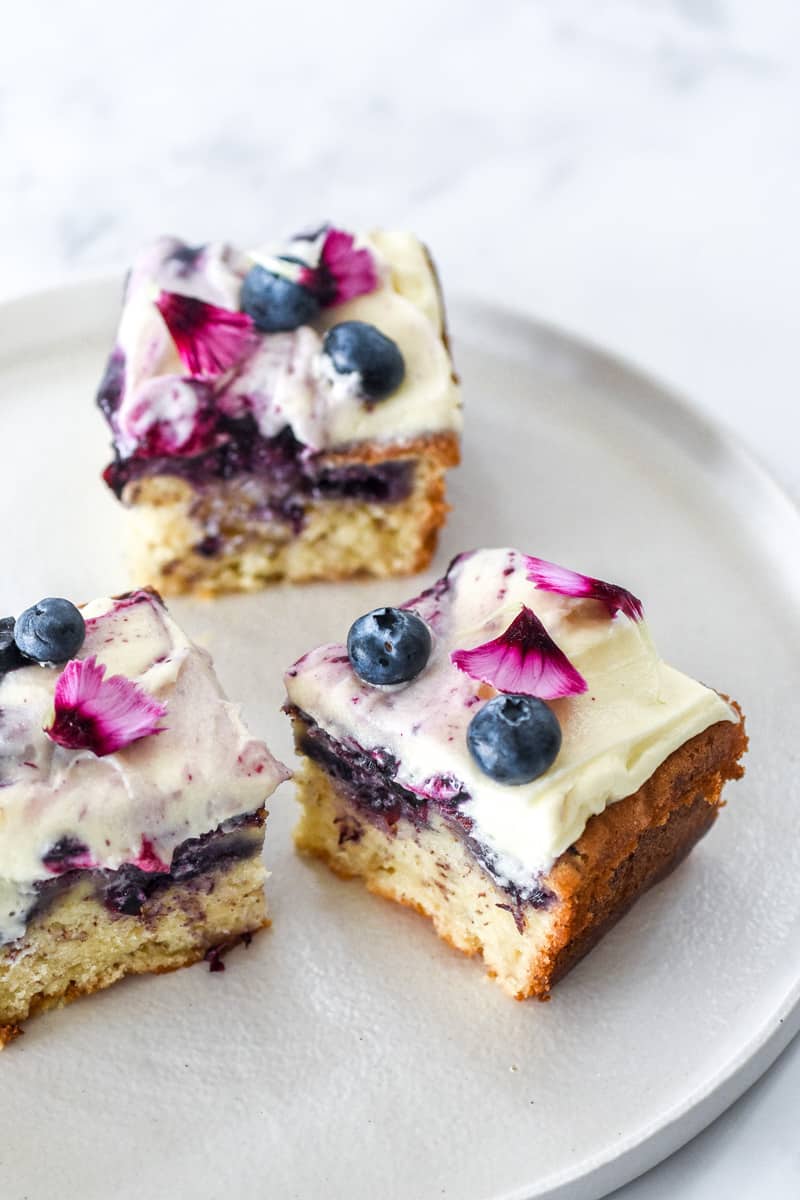 Slices of Blueberry and Banana Cake on a white plate.