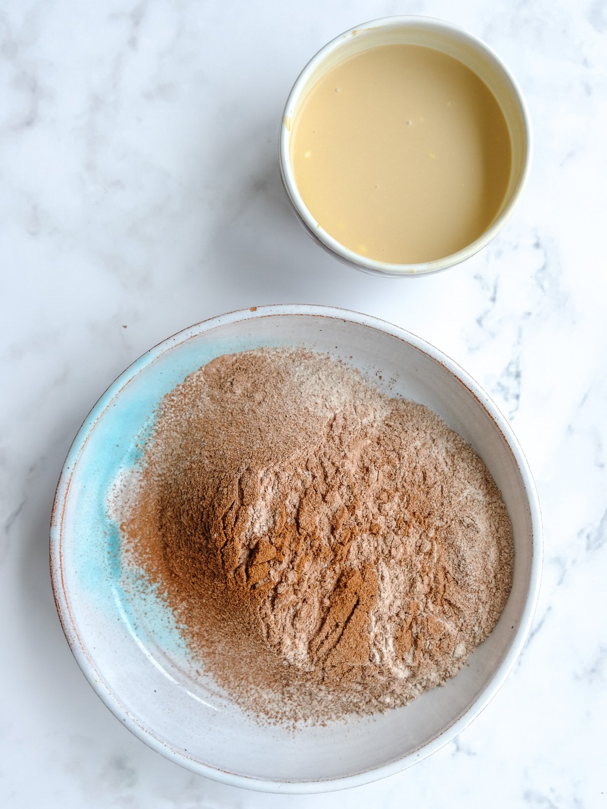 Image shows step 3 of how to make the moist chocolate cake.