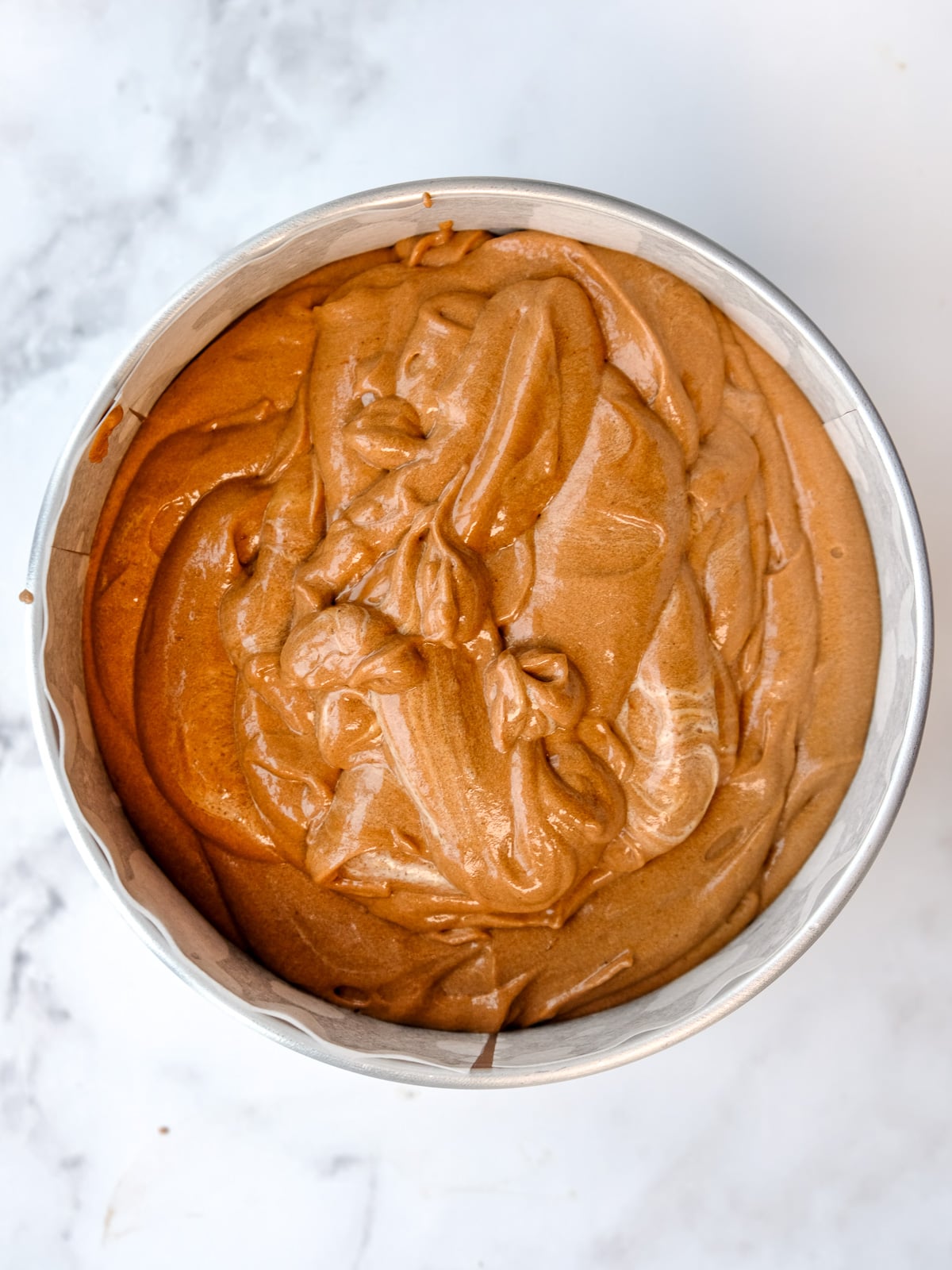 Image shows step 5 of how to make the moist chocolate cake.