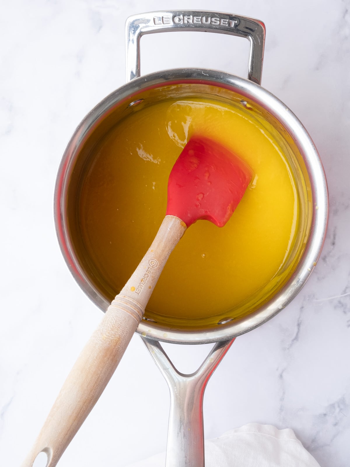 Image shows step 2 of how to make cheesecake Easter eggs.